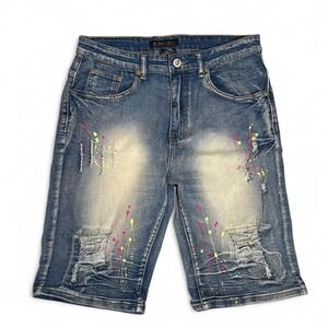 Distressed denim shorts with paint splatter design